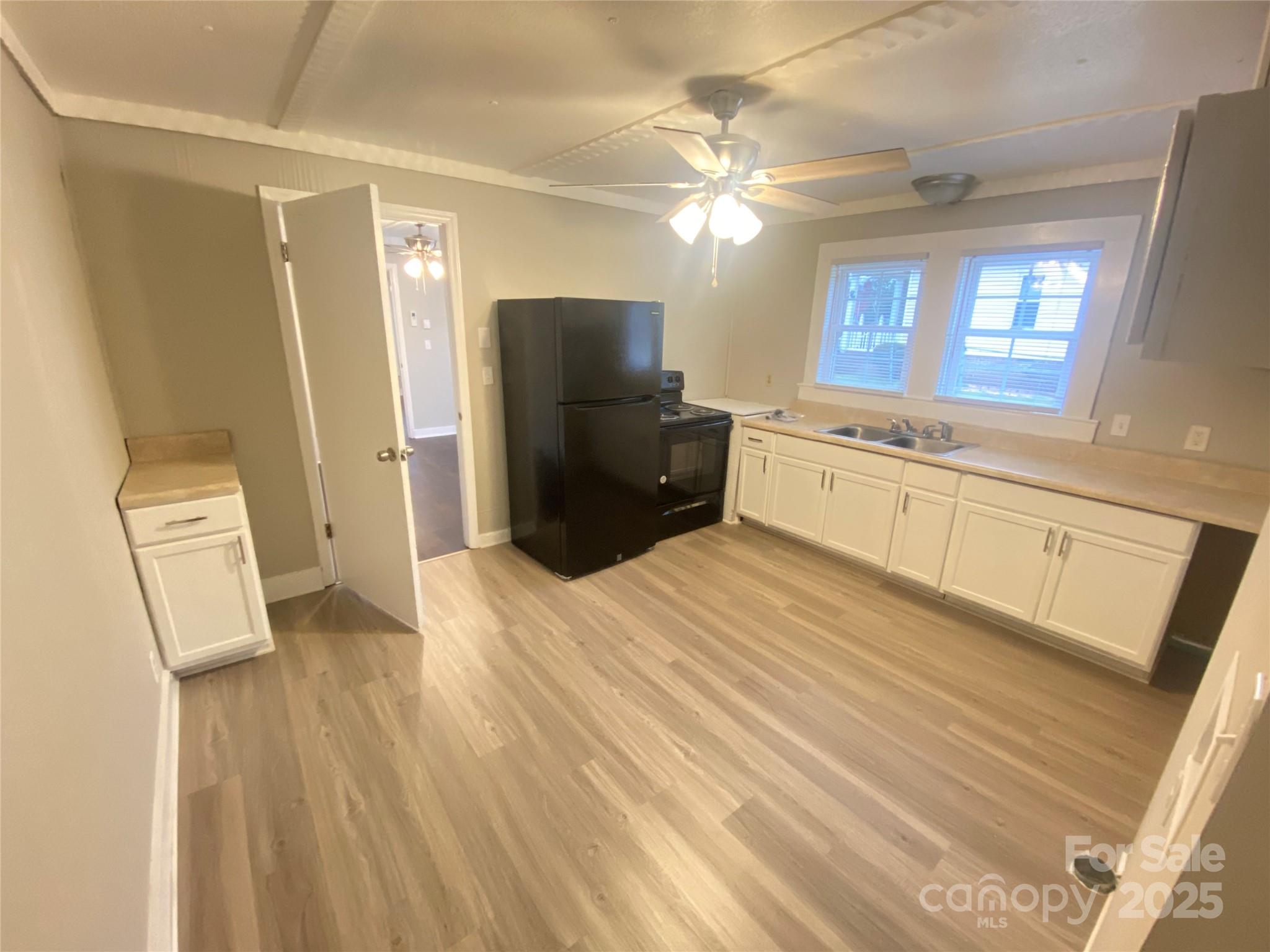 907 Indiana Street Kannapolis, NC 28083 - Photo 7 of 19 a large bathroom with a sink a large mirror and a shower