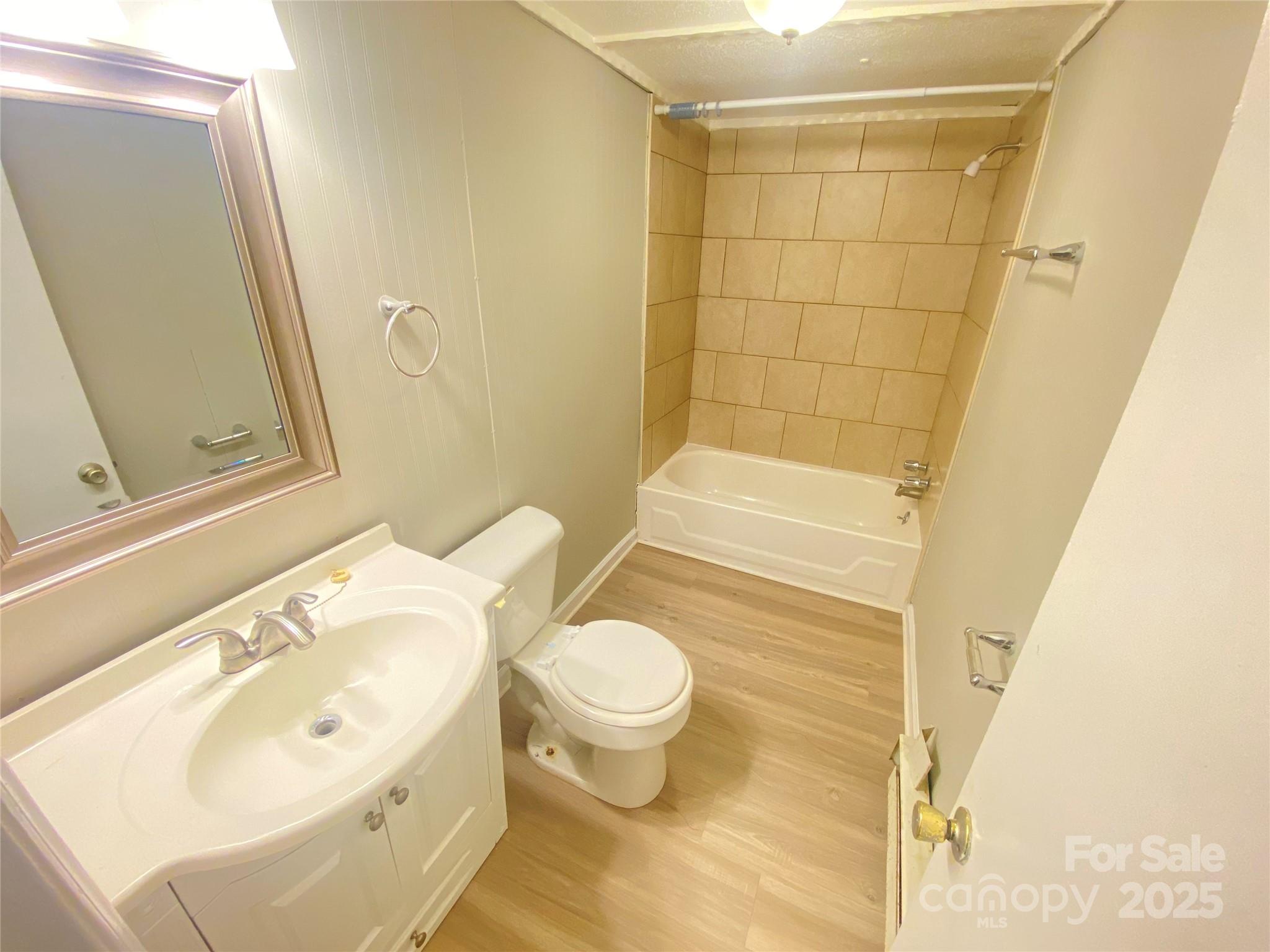 907 Indiana Street Kannapolis, NC 28083 - Photo 8 of 19 a bathroom with a sink and a mirror