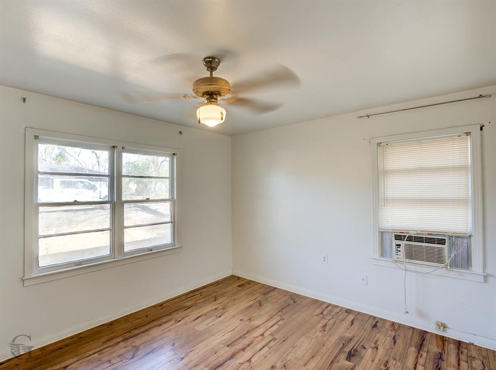 242 Pecan View Drive Minden, LA 71055 - Photo 12 of 20 a view of empty room with wooden floor and fan
