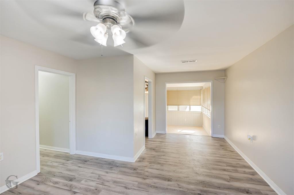 242 Pecan View Drive Minden, LA 71055 - Photo 4 of 20 a view of a hallway with wooden floor and a chandelier