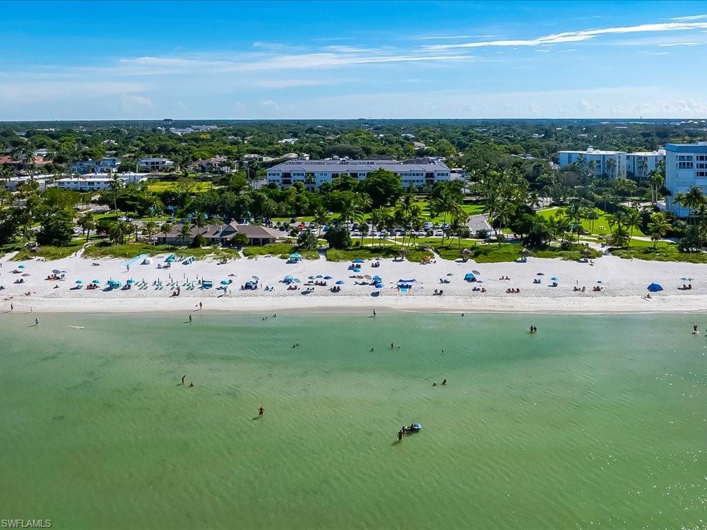 1390 Mandarin Road Naples, FL 34102 - Photo 46 of 50 Coastal setting with white sand beach and calm green waters