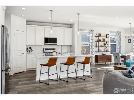 a kitchen with stainless steel appliances kitchen island granite countertop a sink and cabinets