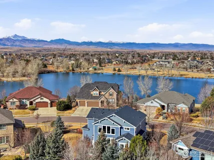 an aerial view of residential houses and outdoor space