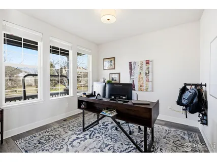 a workspace with furniture and a window
