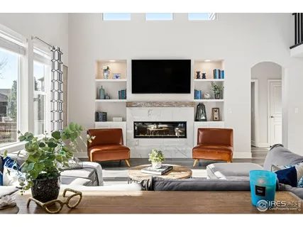 a living room with furniture fireplace and flat screen