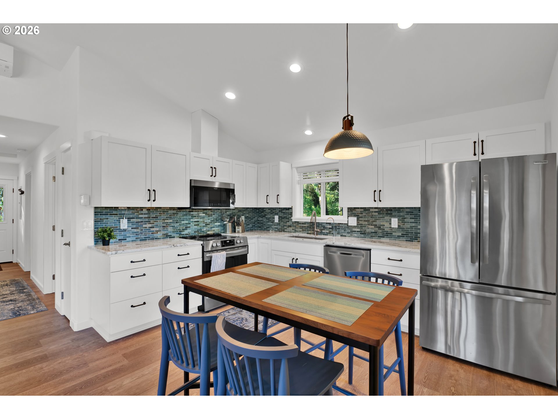 87620 Parkside Drive Florence, OR 97439 - Photo 15 of 35 a kitchen with stainless steel appliances granite countertop a refrigerator a stove a sink dishwasher a oven with a dining table and chairs