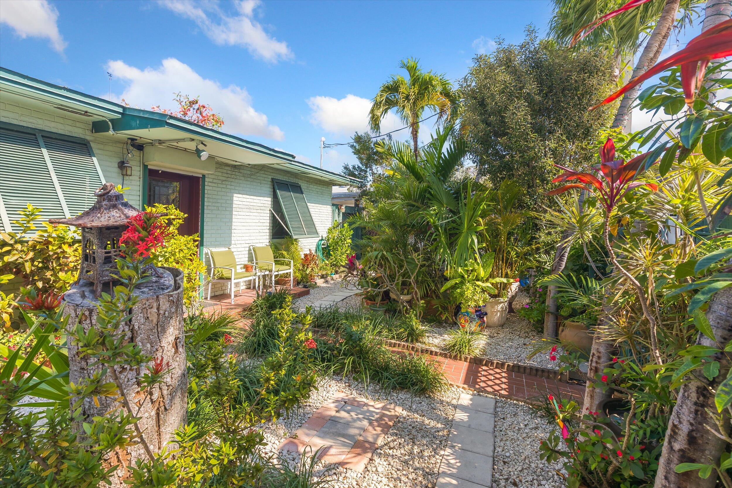 1713 Rose Street Key West, FL 33040 - Photo 2 of 44 a front view of a house with a yard