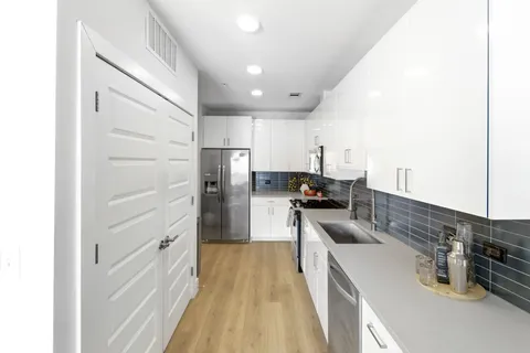 a kitchen with cabinets and a sink
