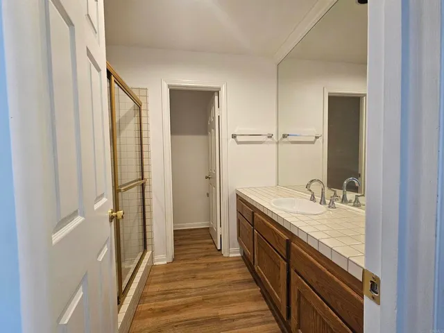 a bathroom with a double vanity sink and a mirror