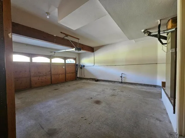 a view of an empty room with windows