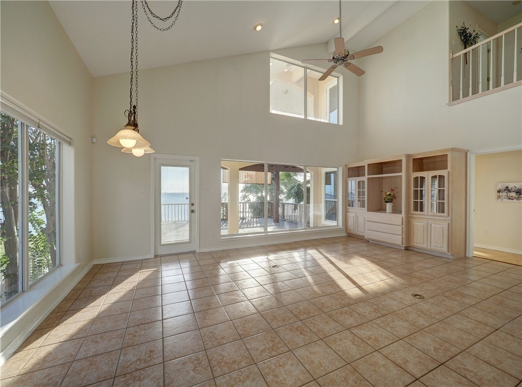 1343 Bayview Drive Portland, TX 78374 - Photo 11 of 36 a view of an empty room with a window and chandelier fan