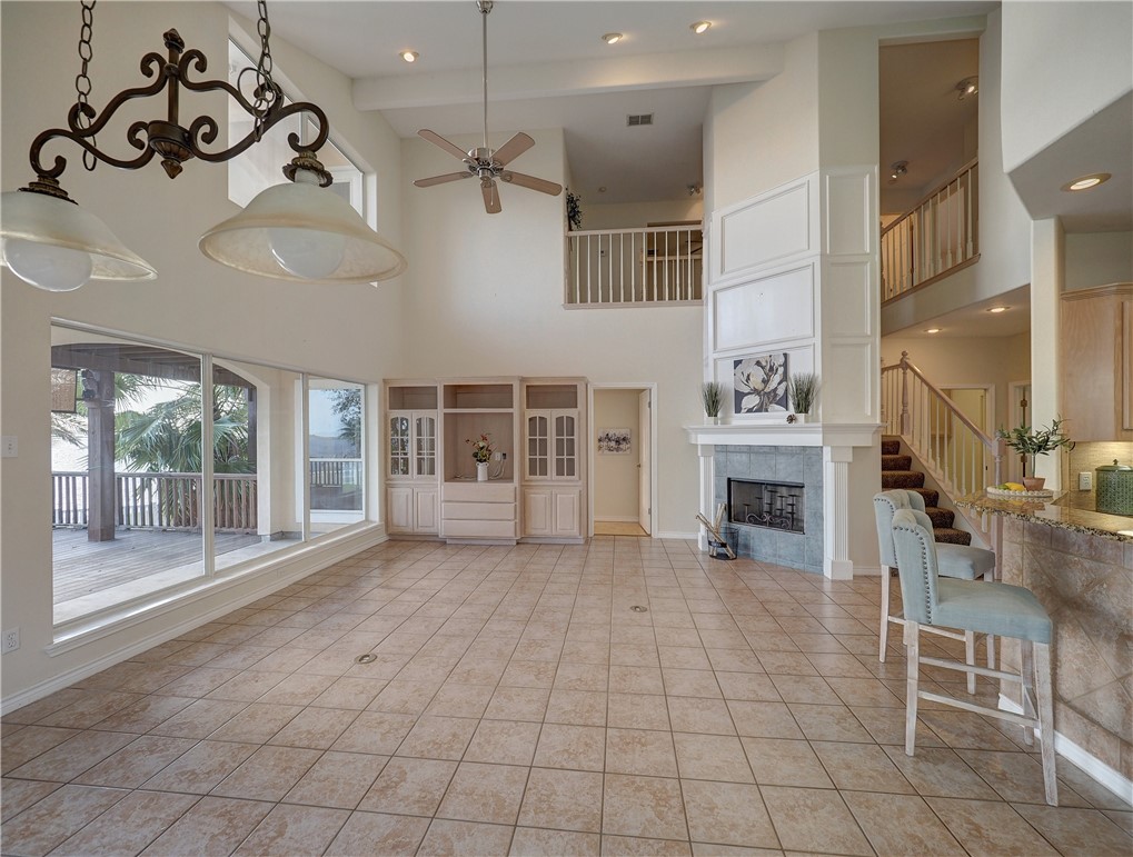 1343 Bayview Drive Portland, TX 78374 - Photo 12 of 36 an empty room with windows and fireplace