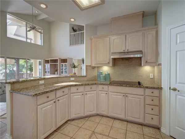 a kitchen with a sink and cabinets