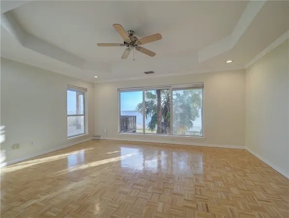 a view of a room with a ceiling fan