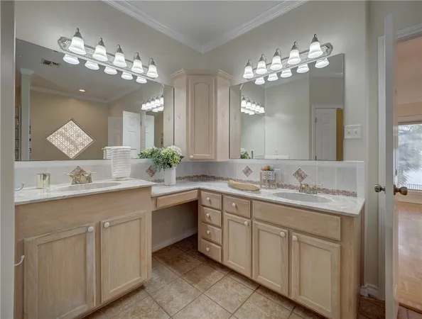a bathroom with a granite countertop shower a sink and a mirror