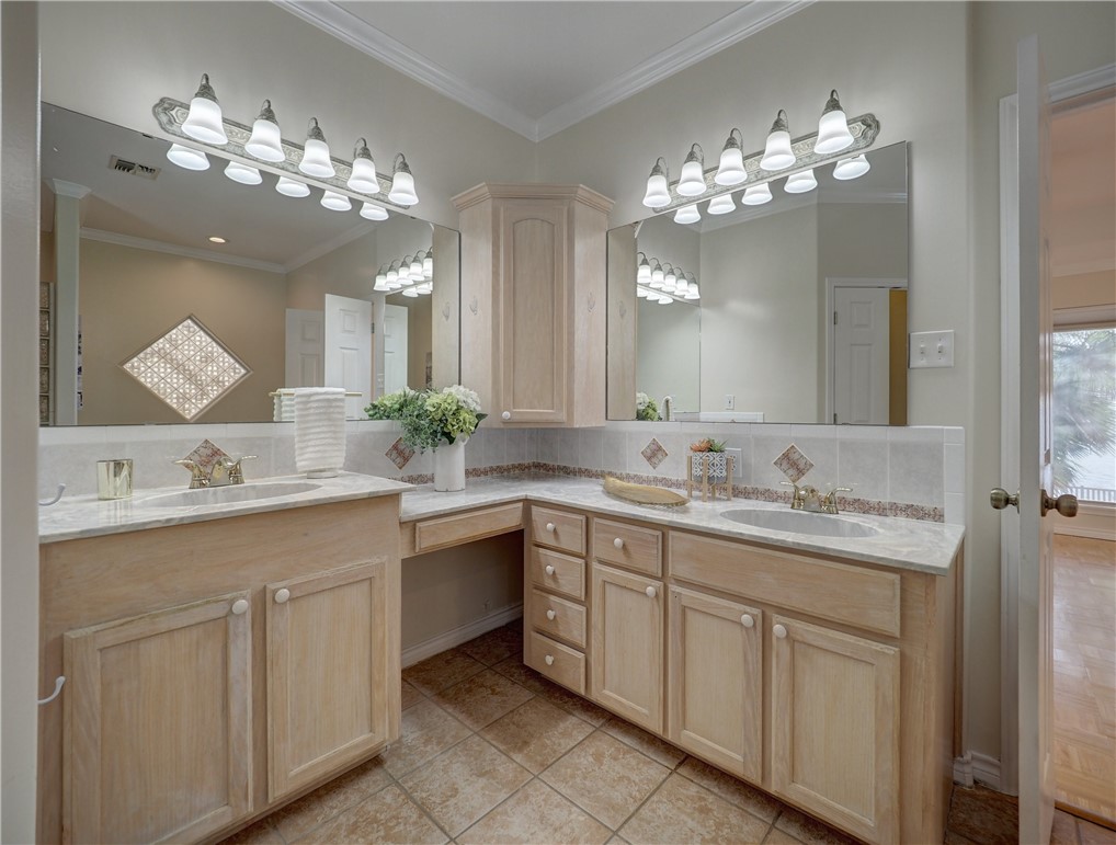 1343 Bayview Drive Portland, TX 78374 - Photo 24 of 36 a bathroom with a sink vanity and mirror
