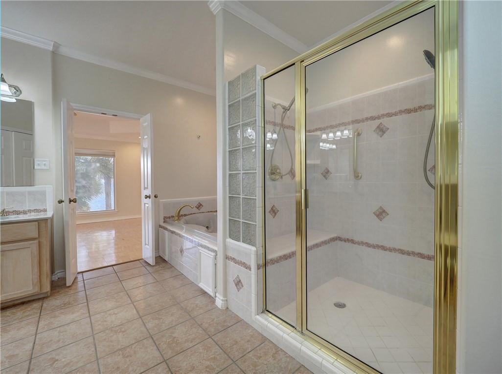 1343 Bayview Drive Portland, TX 78374 - Photo 25 of 36 a bathroom with a granite countertop shower a sink and a mirror