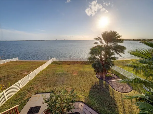 a view of a swimming pool and an outdoor space