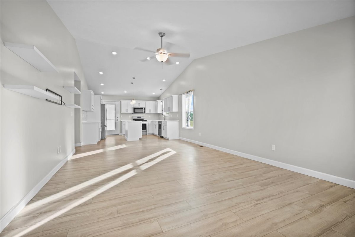 52 Winding Way Bloomington, IL 61705 - Photo 12 of 51 a view of kitchen and hall with wooden floor