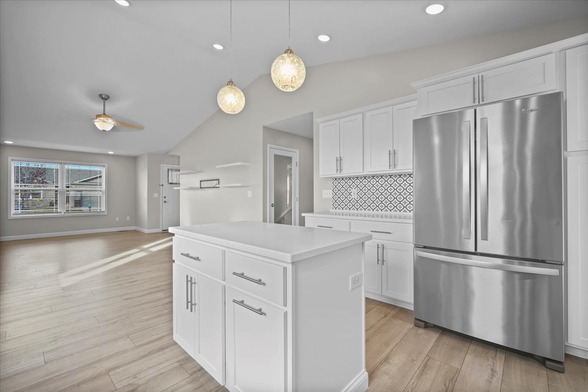 52 Winding Way Bloomington, IL 61705 - Photo 19 of 51 a kitchen with white cabinets and stainless steel appliances