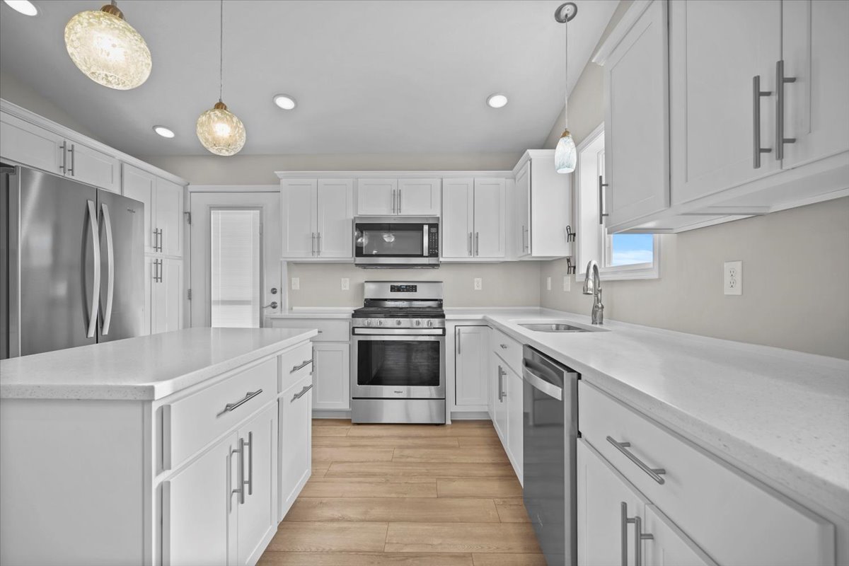 52 Winding Way Bloomington, IL 61705 - Photo 20 of 51 a kitchen with cabinets stainless steel appliances a sink and a stove