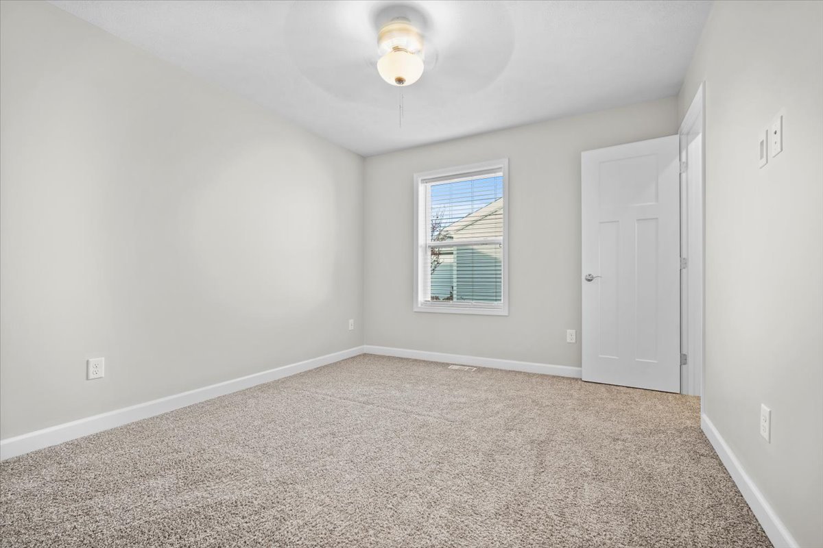 52 Winding Way Bloomington, IL 61705 - Photo 23 of 51 an empty room with windows and closet