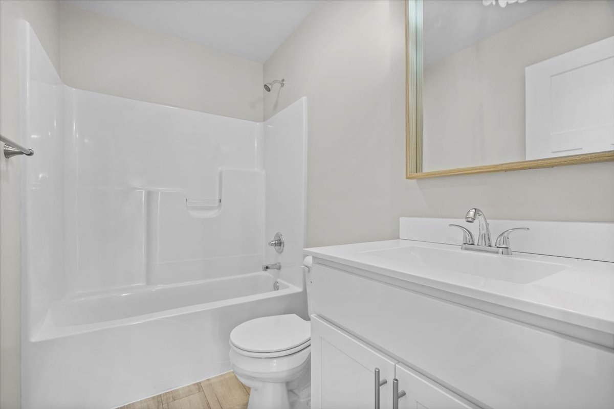 52 Winding Way Bloomington, IL 61705 - Photo 25 of 51 a bathroom with a sink a toilet and a bathtub