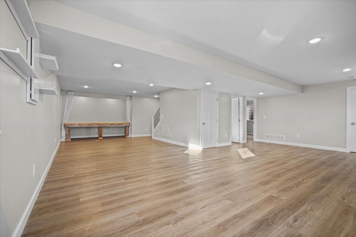52 Winding Way Bloomington, IL 61705 - Photo 33 of 51 a view of an empty room with wooden floor