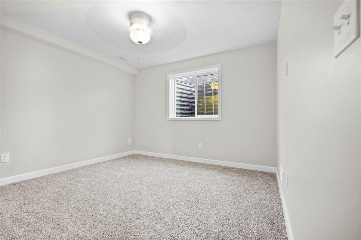 52 Winding Way Bloomington, IL 61705 - Photo 37 of 51 an empty room with a window