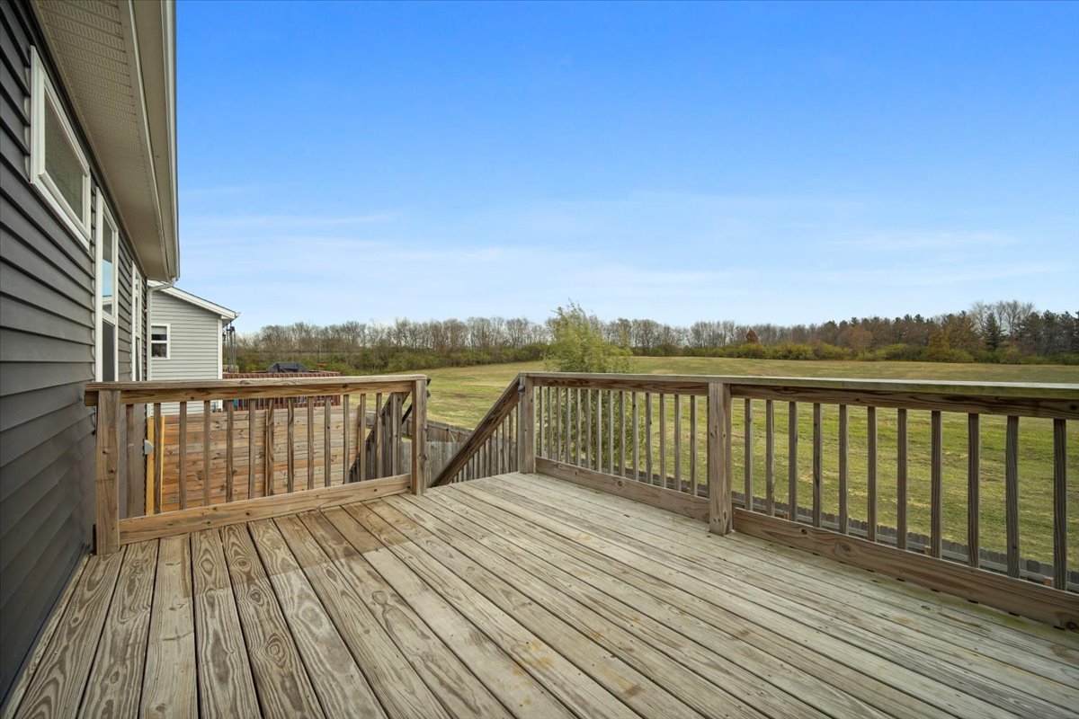 52 Winding Way Bloomington, IL 61705 - Photo 9 of 51 a view of balcony with wooden floor and fence