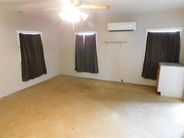 a view of a bathroom with a sink and a mirror