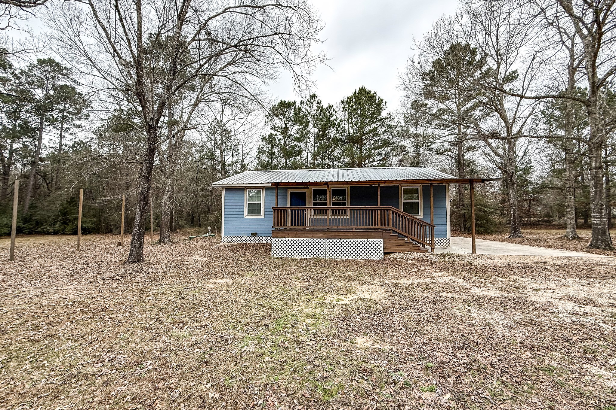 52 C Hank Benge Road Huntsville, TX 77320 - Photo 1 of 24 a view of a house with a yard