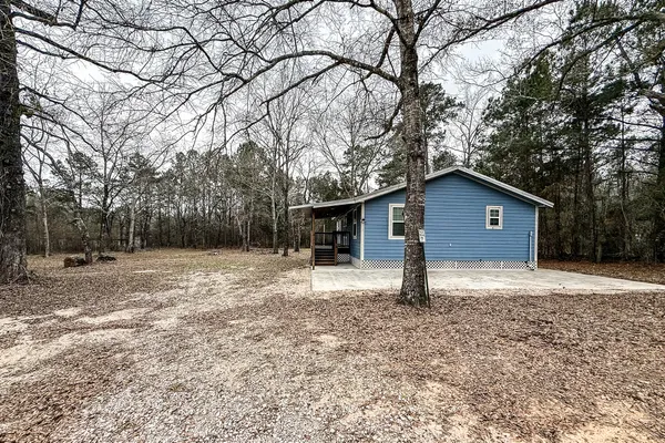 a house with trees in the background