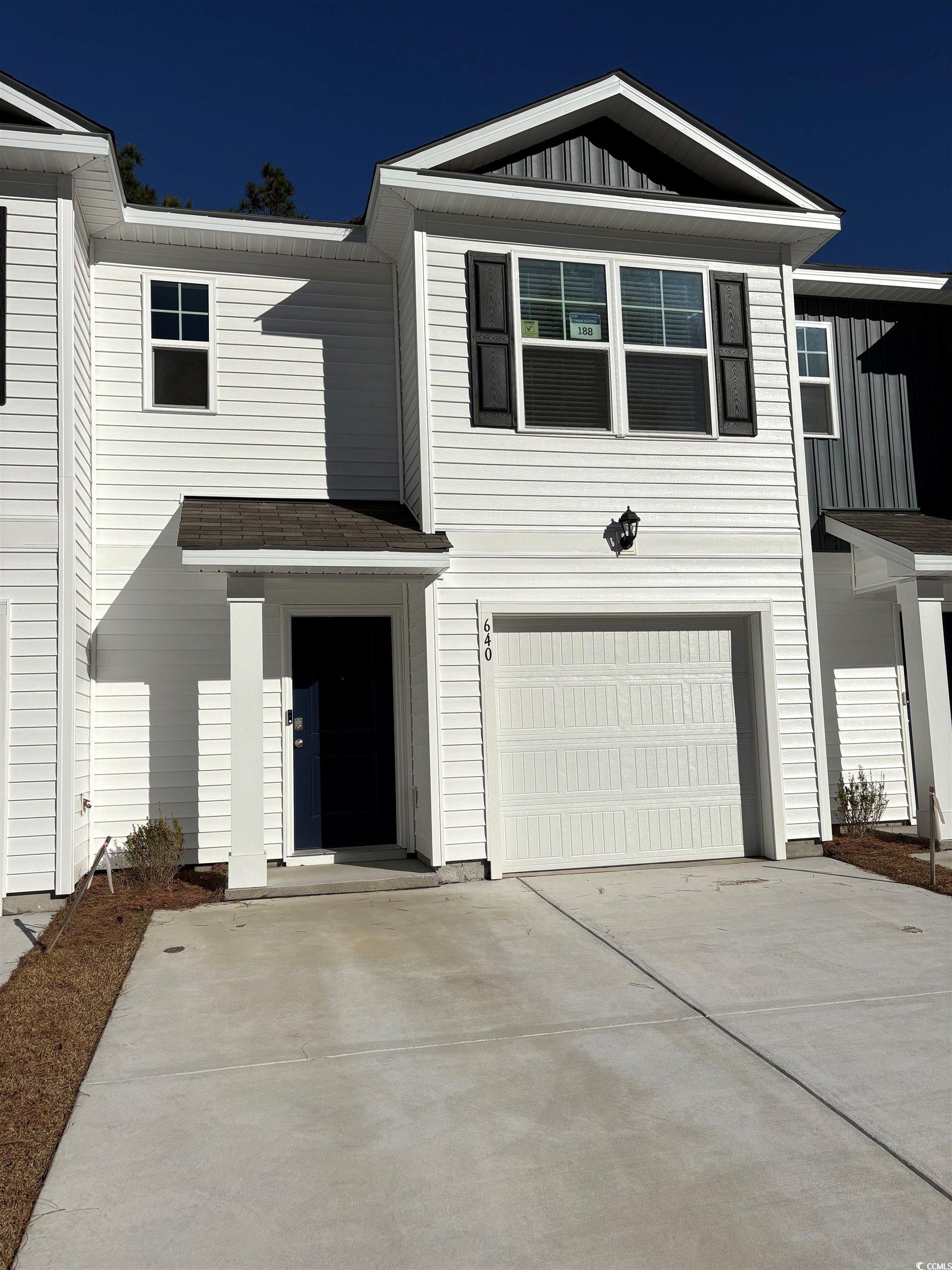 640 Golden Resin Road, Unit LOT 188 Conway, SC 29526 - Photo 1 of 40 View of front of home with an attached garage, board and batten siding, and driveway