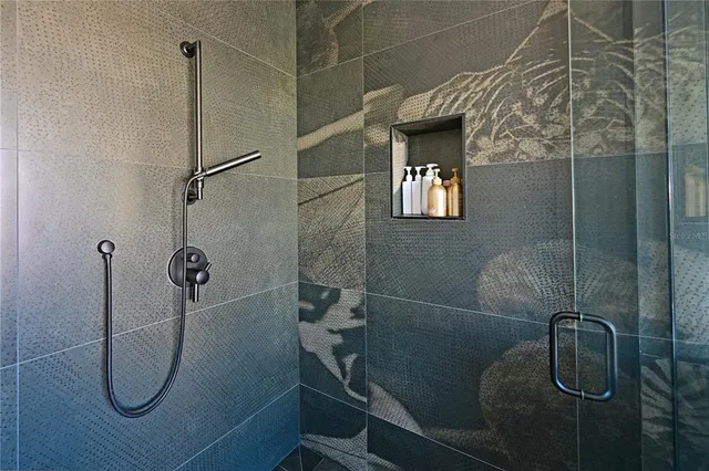 a bathroom with a sink a toilet and a shower