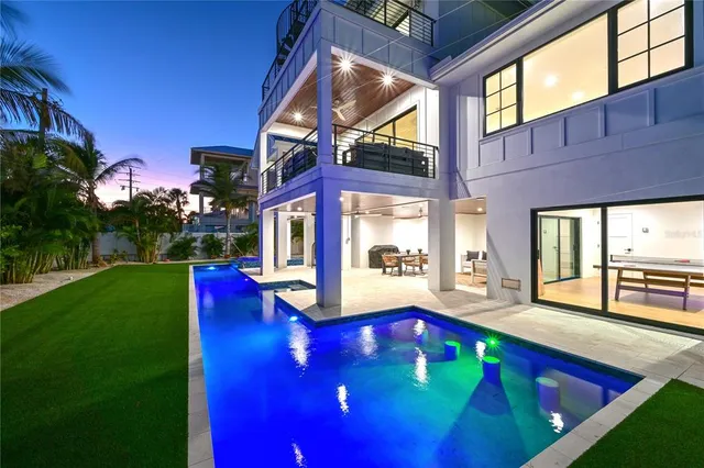 a view of an chairs in a backyard