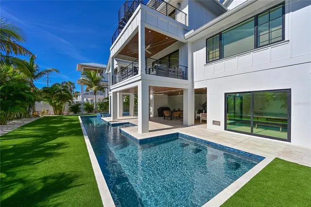 a view of a house with a yard porch and sitting area