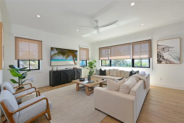 a living room with furniture or kitchen view and a large window