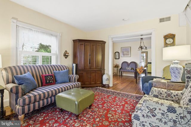 a bedroom with a large bed and a couch