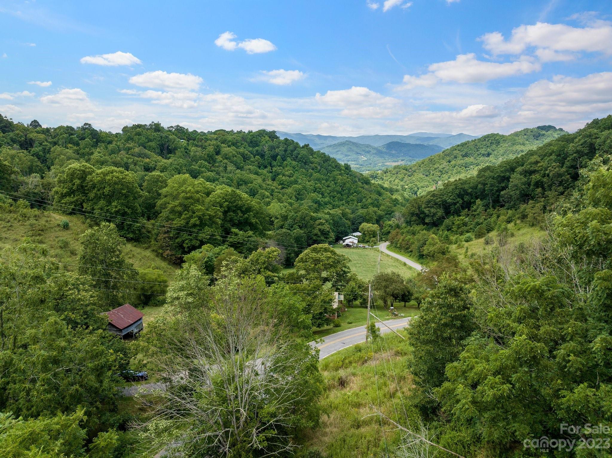 0 Big Branch Road Clyde, NC 28721 - Photo 2 of 18 a view of a house with a street and trees
