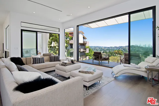 a living room with fireplace furniture and a flat screen tv