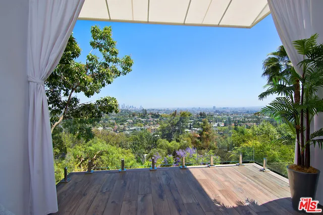 a view of a dining room with furniture and a window