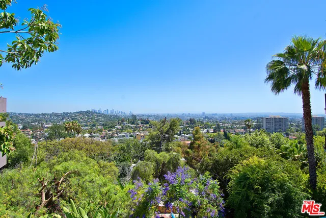 a bathroom with a sink mirror toilet and bathtub