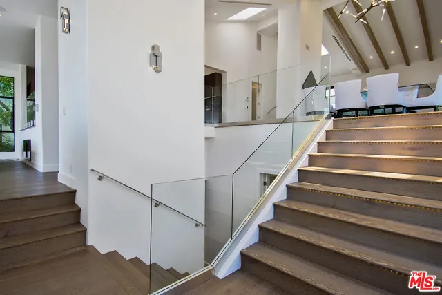 a living room with furniture and a mirror