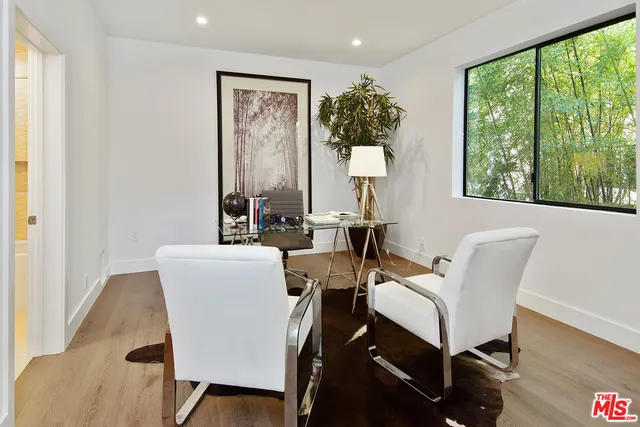 a spacious bedroom with a large bed and a couch