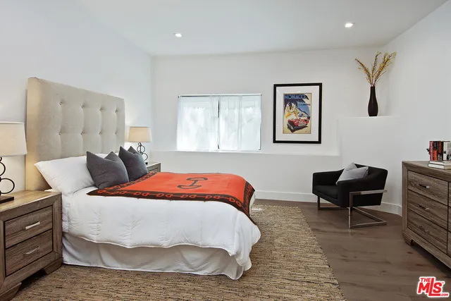 a spacious bathroom with a large tub shower and sink