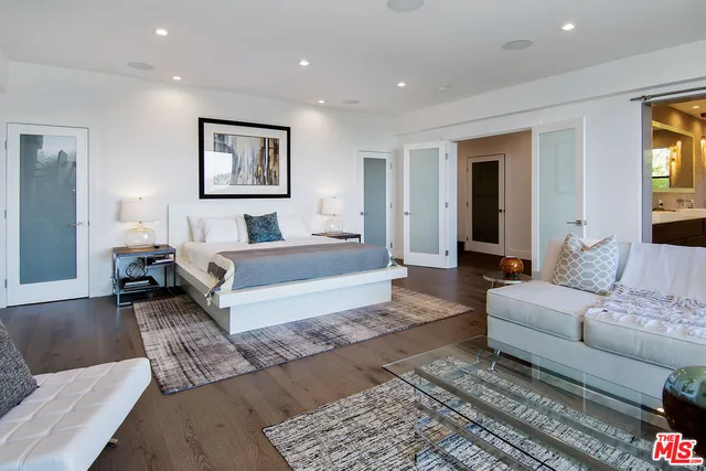 a view of walk in closet and empty room