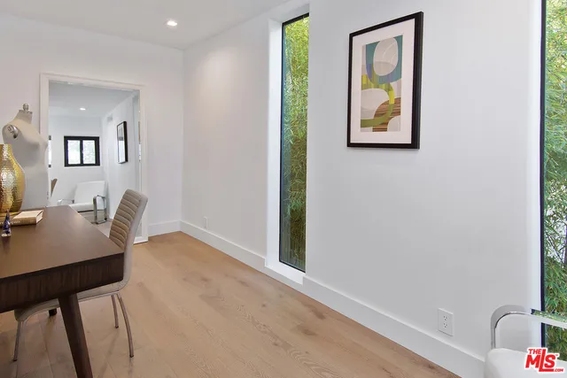a utility room with cabinets and washer