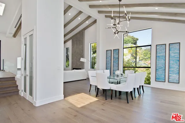 a bathroom with a sink mirror vanity and toilet