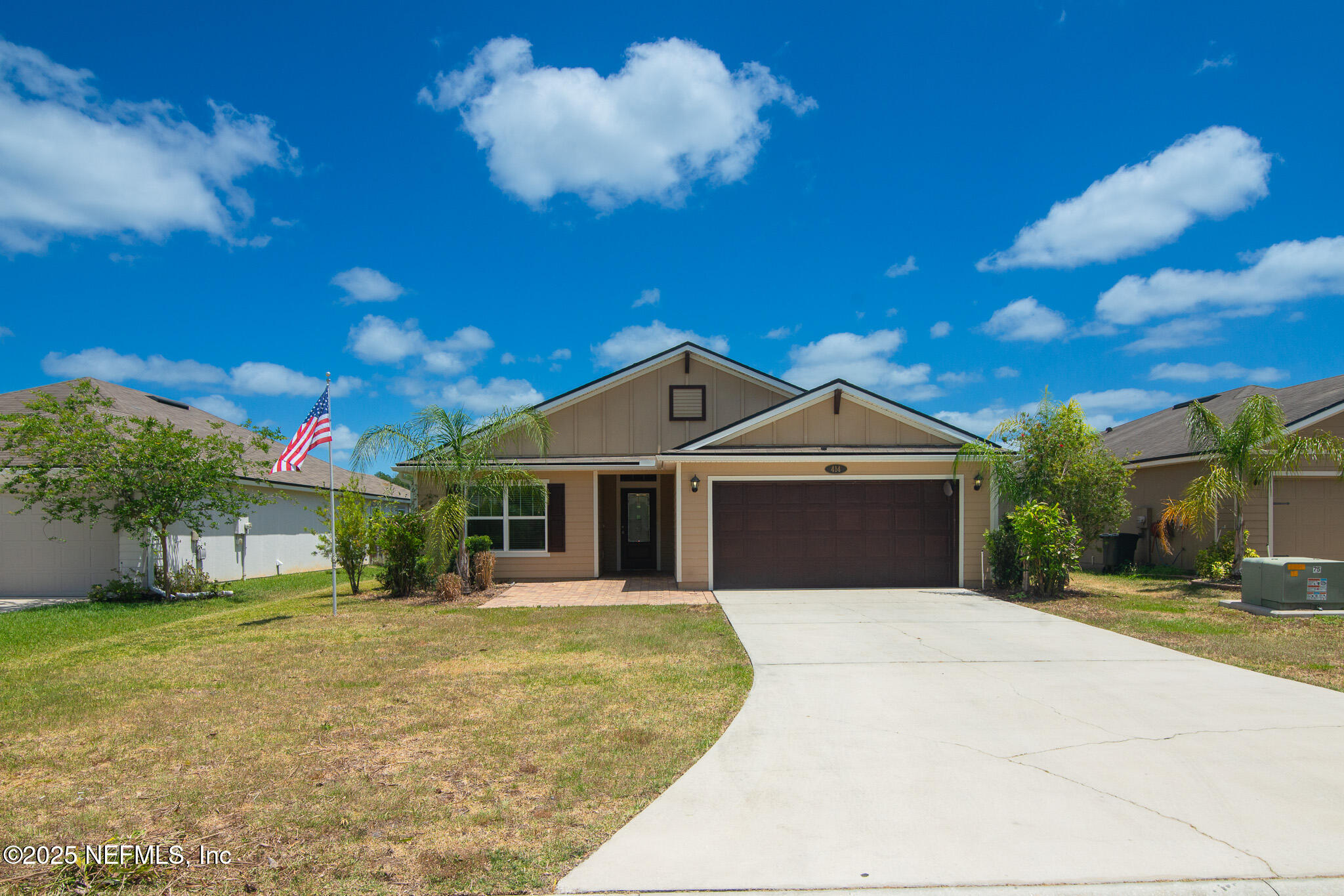 a front view of a house with a yard